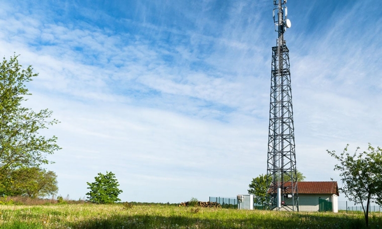 Rural cell tower on a farm.