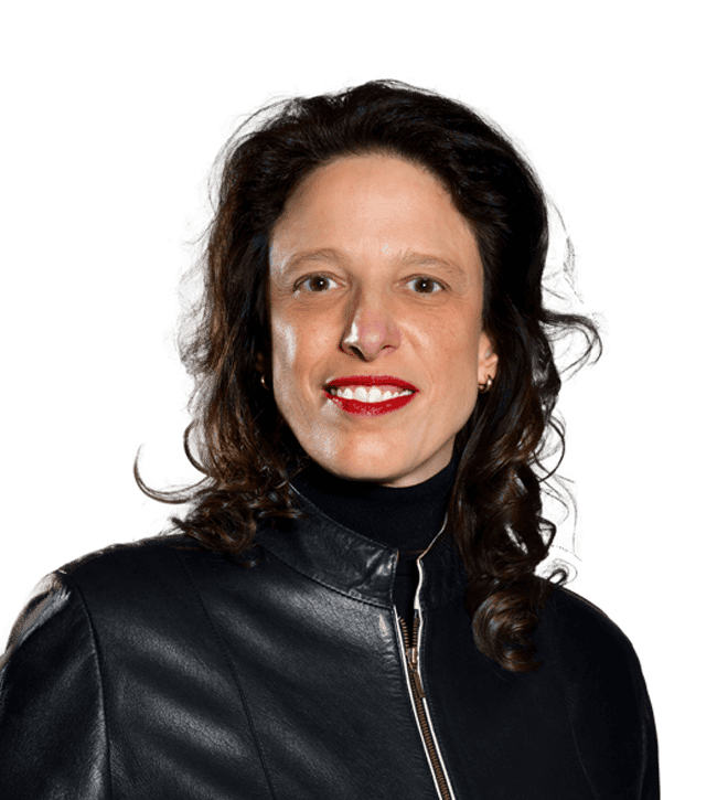 Smiling woman with dark hair, wearing a black leather jacket and red lipstick, facing the camera.